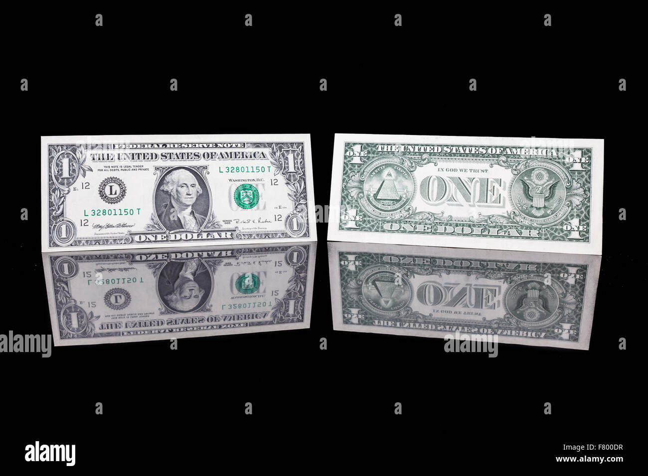 one dollar bill as well as the front and the back with reflection Stock Photo