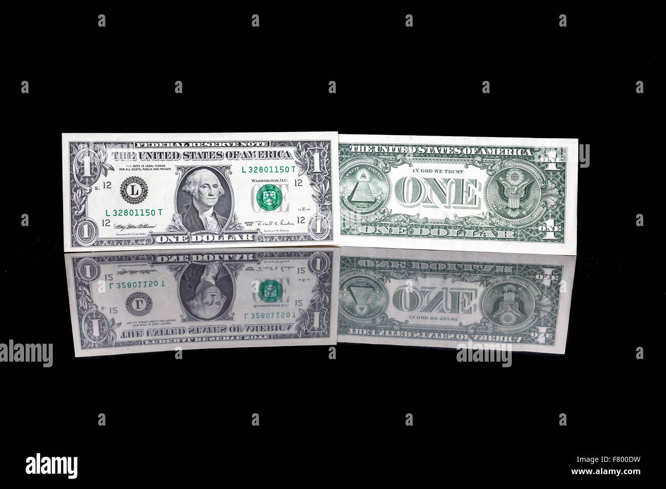 one dollar bill as well as the front and the back with reflection Stock Photo