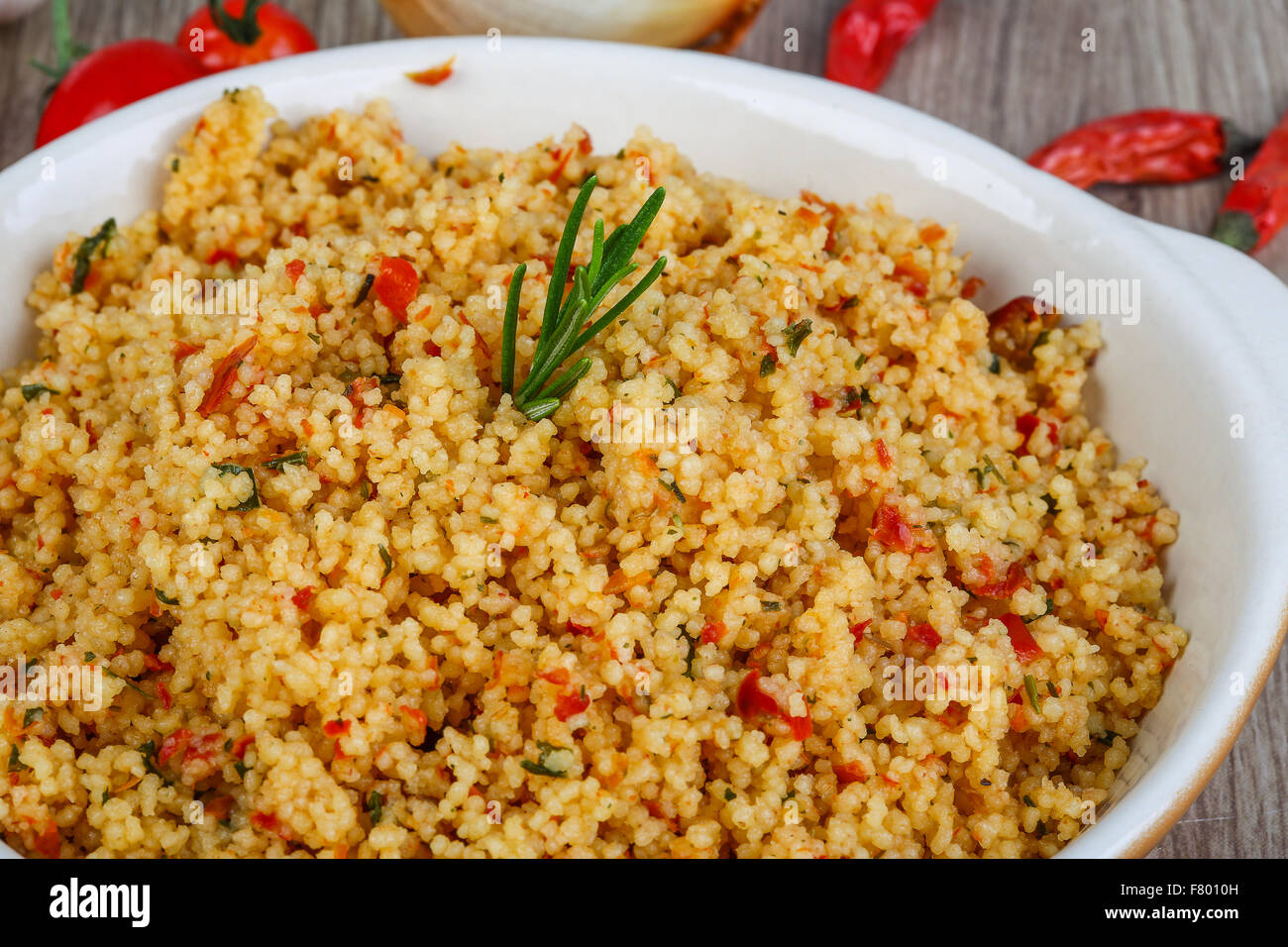 Arabic traditional cuisine Couscous with tomato and green onion Stock