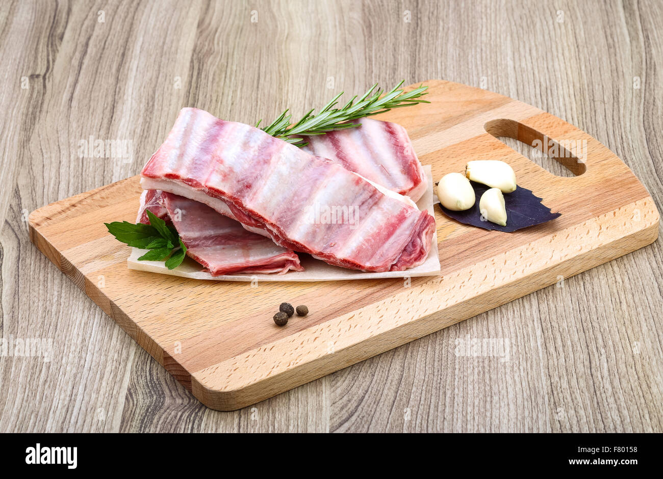 Fresh cold Raw lamb ribs with garlik and pepper - ready for cooking ...