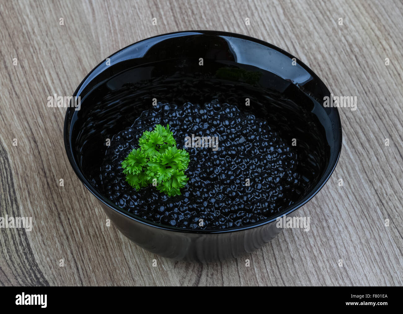 Luxury Black caviar in the bowl with parsley leaves Stock Photo Alamy