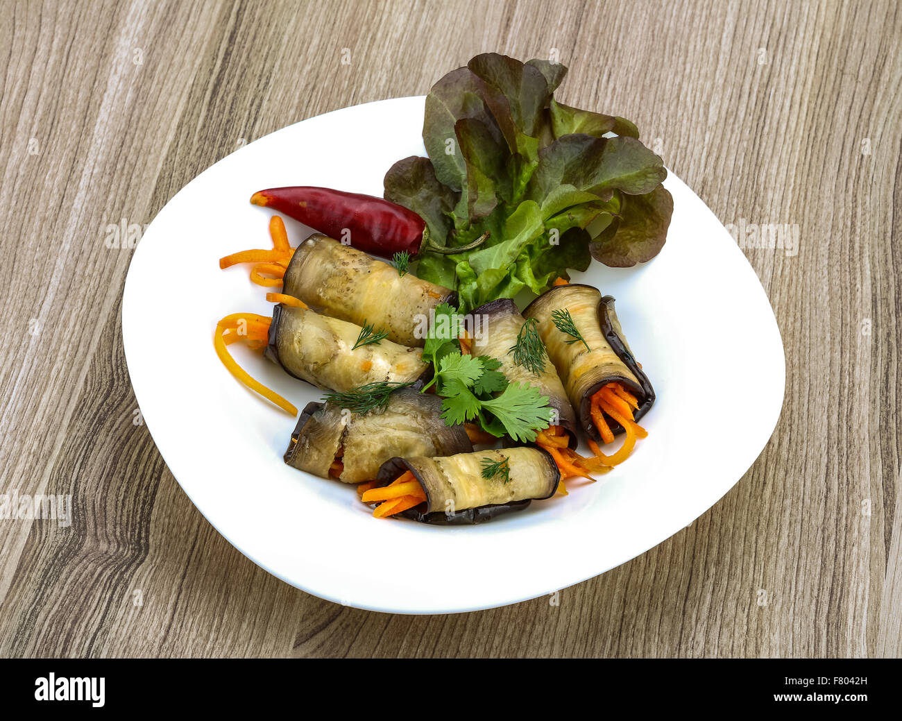 Eggplant rolls with carrot served spices and coriander Stock Photo Alamy