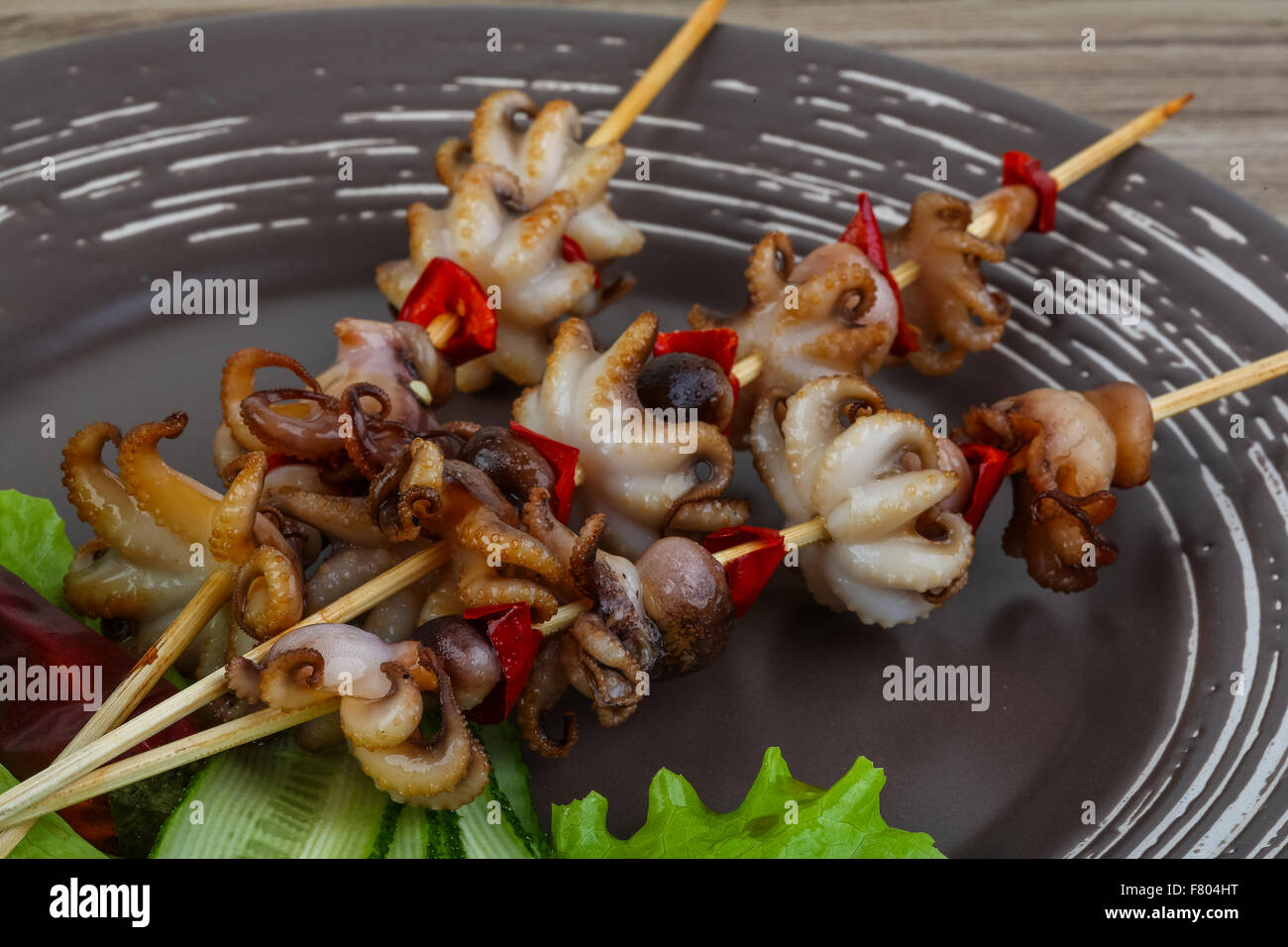 Barbecue baby octopus with bell pepper and spices Stock Photo Alamy