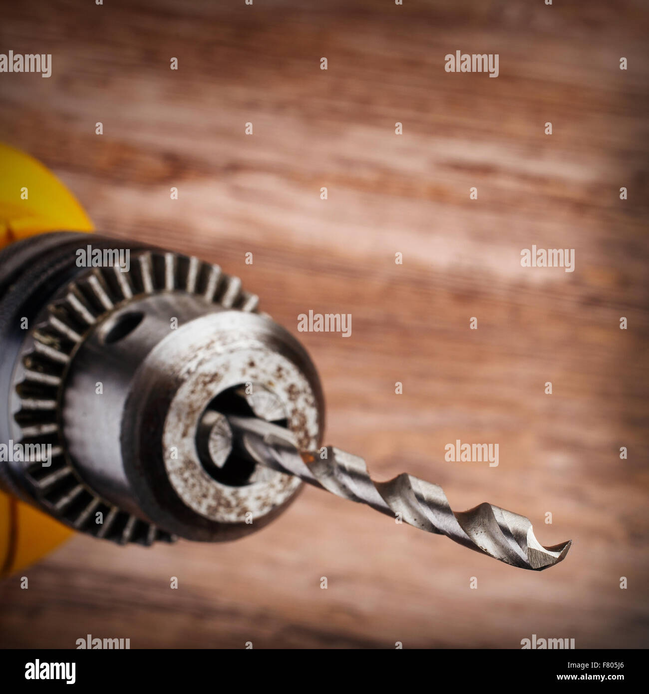 drill on a wooden background Stock Photo