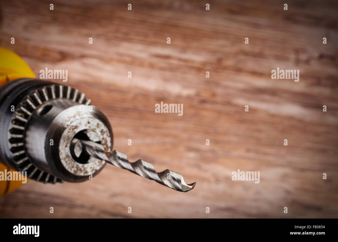 drill on a wooden background Stock Photo
