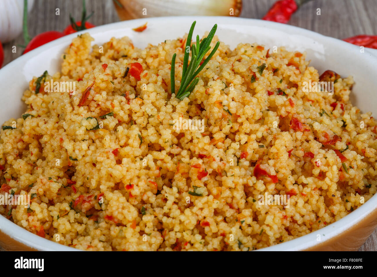 Arabic traditional cuisine Couscous with tomato and green onion Stock