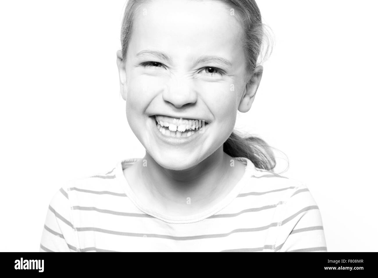 Portrait from a young girl in front of white background Stock Photo
