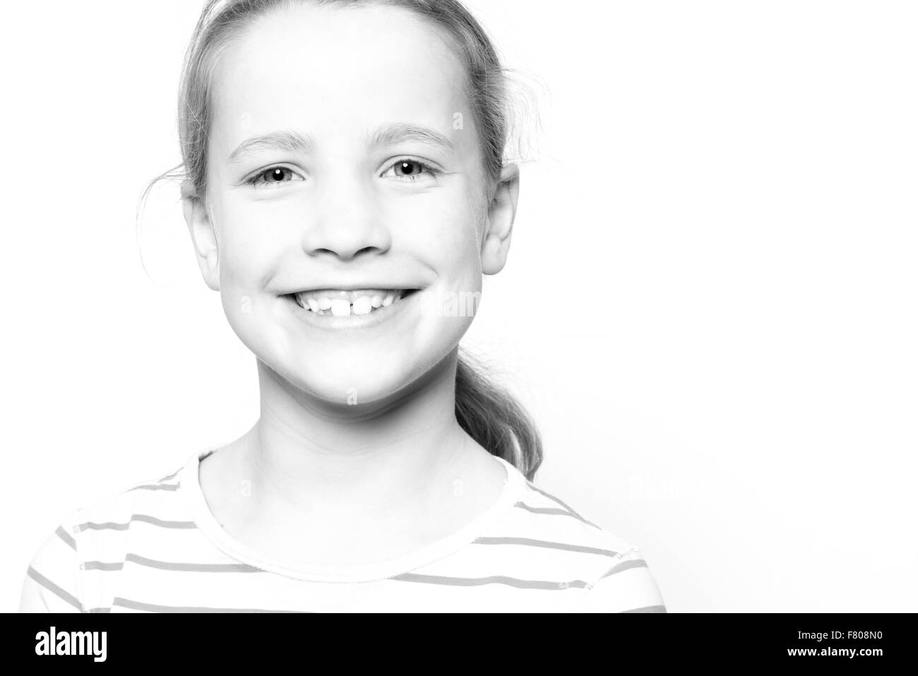 Portrait from a young girl in front of white background Stock Photo - Alamy