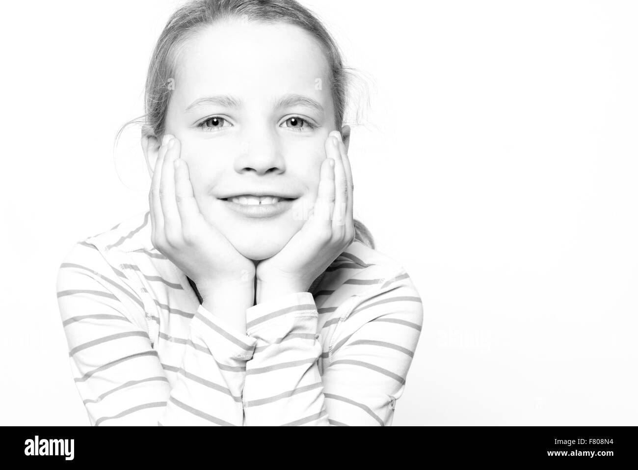 Portrait from a young girl in front of white background Stock Photo - Alamy