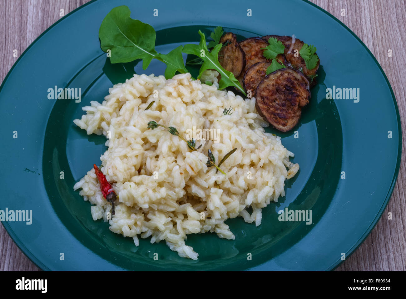 Italian trditional Risotto with eggplant and coriander Stock Photo Alamy