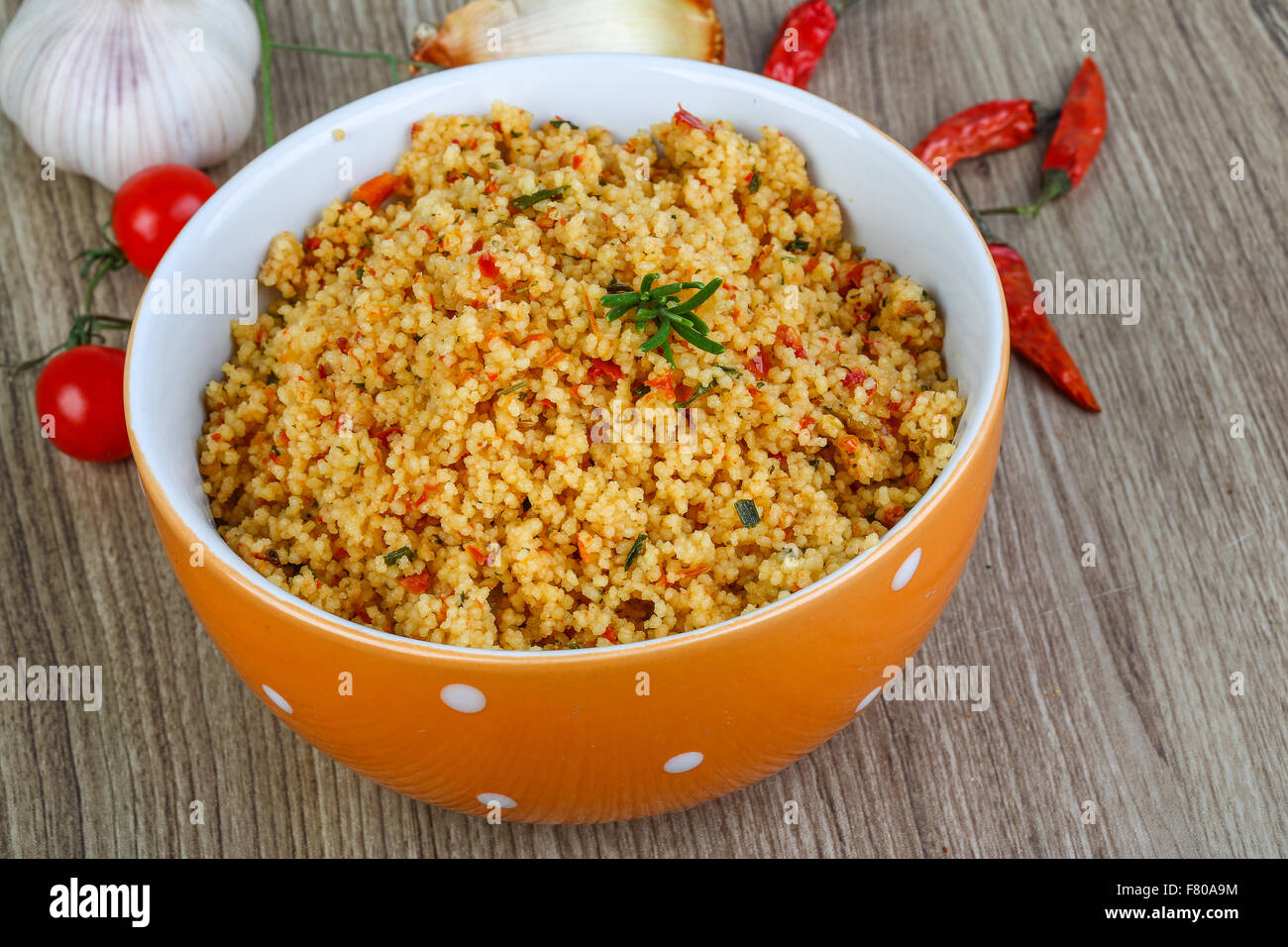 Arabic traditional cuisine Couscous with tomato and green onion Stock