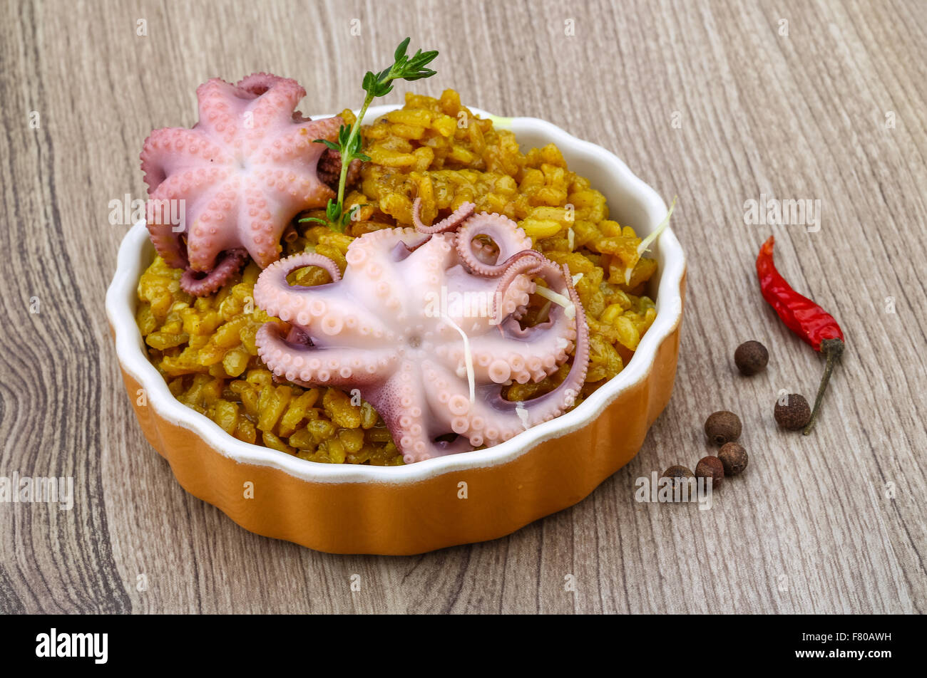 Seafood risotto with octopus, cheese and thyme leaf Stock Photo - Alamy