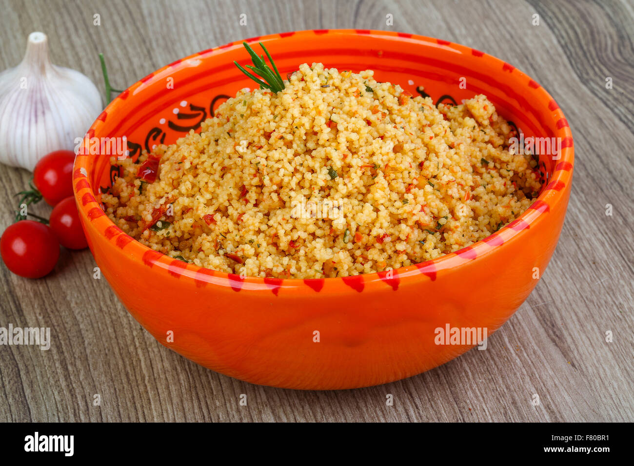 Arabic traditional cuisine Couscous with tomato and green onion Stock
