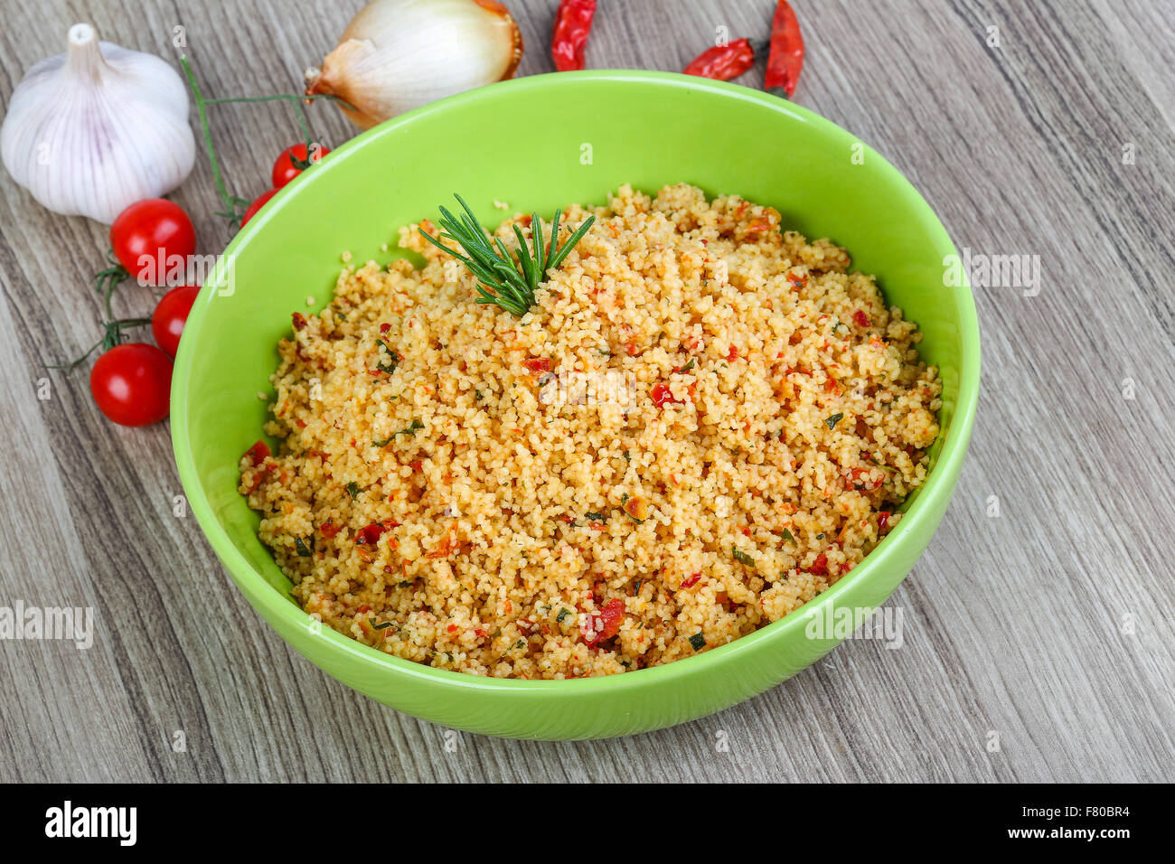 Arabic traditional cuisine Couscous with tomato and green onion Stock