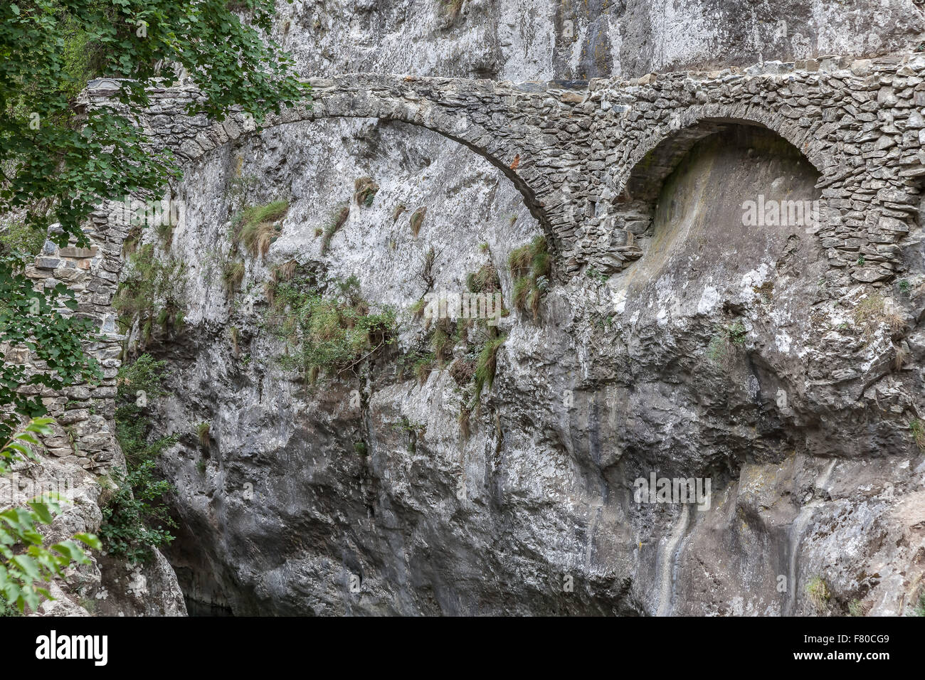 The old bridge at Saorge. Saorge is a very beautiful medieval town in Alpes-Maritimes department in southeastern France. Stock Photo