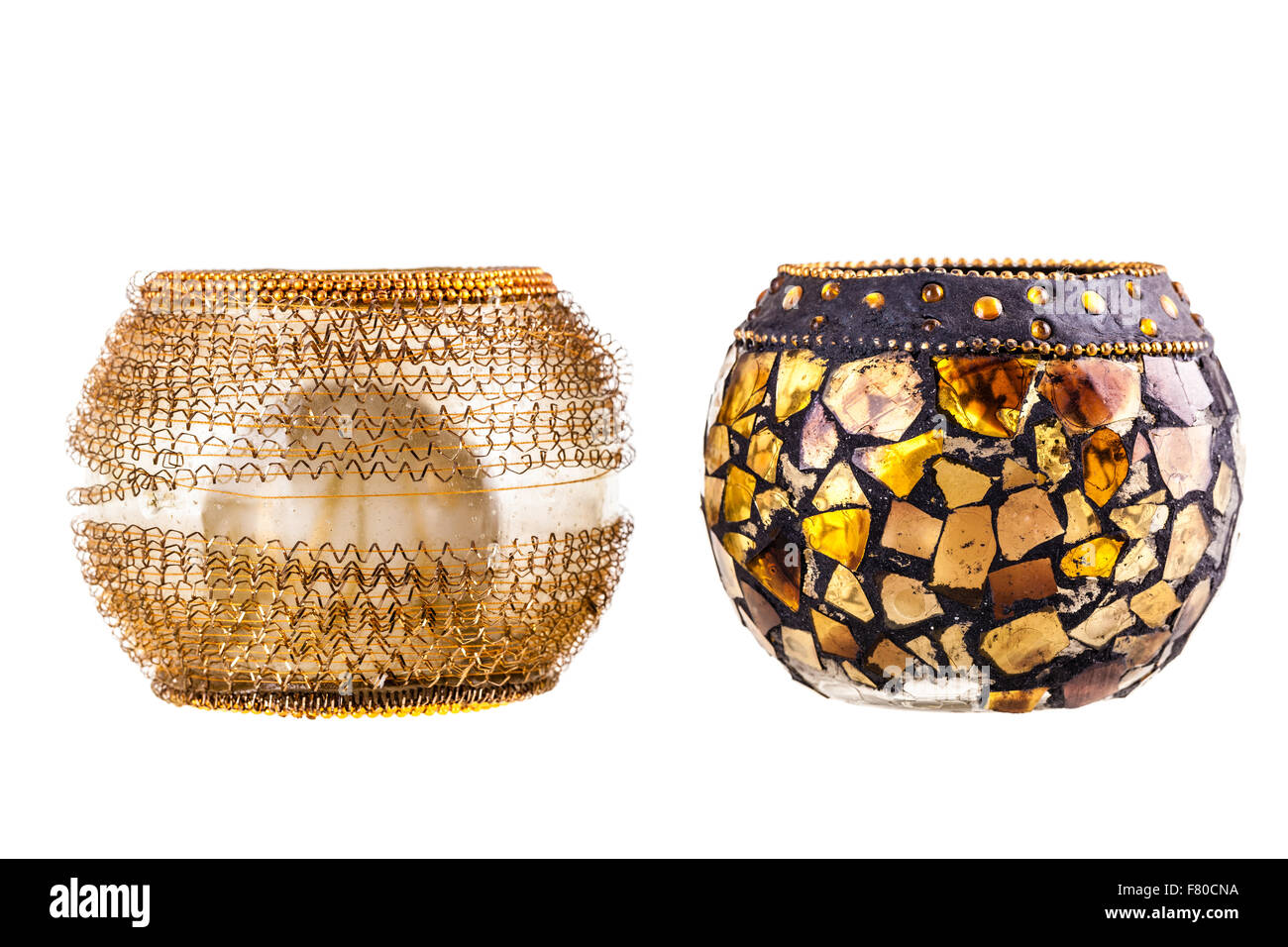 two golden modern candle holders isolated over a white background Stock ...