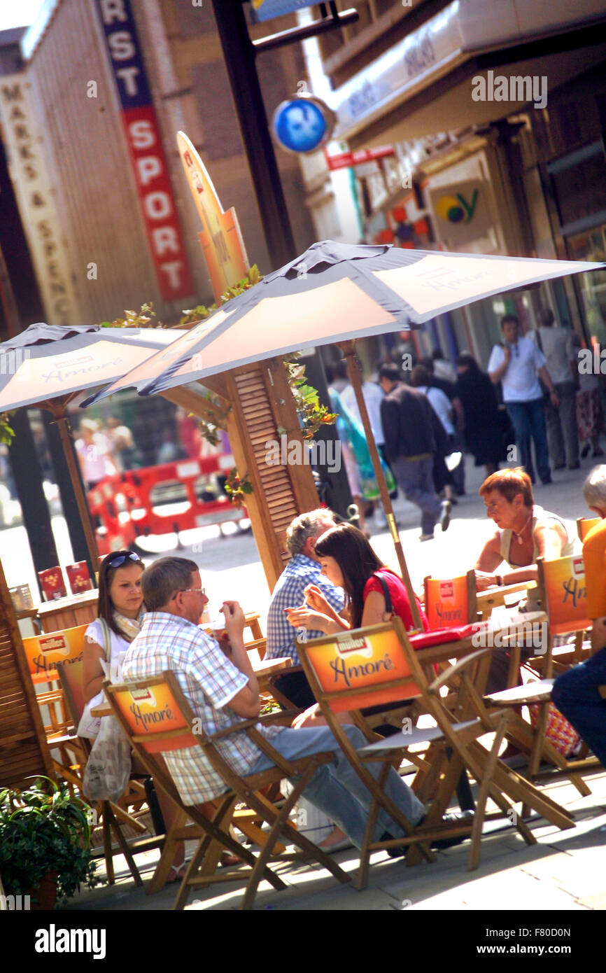 Crowds eating and drinking on a sunny day, Northumberland Street, Newcastle Stock Photo