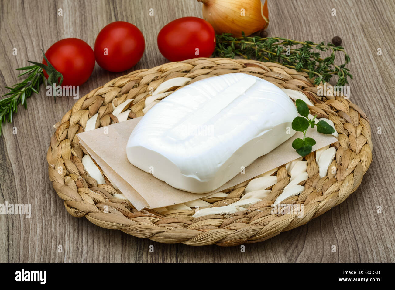 Traditional Greek cheese - Feta with herbs on the wood background Stock ...
