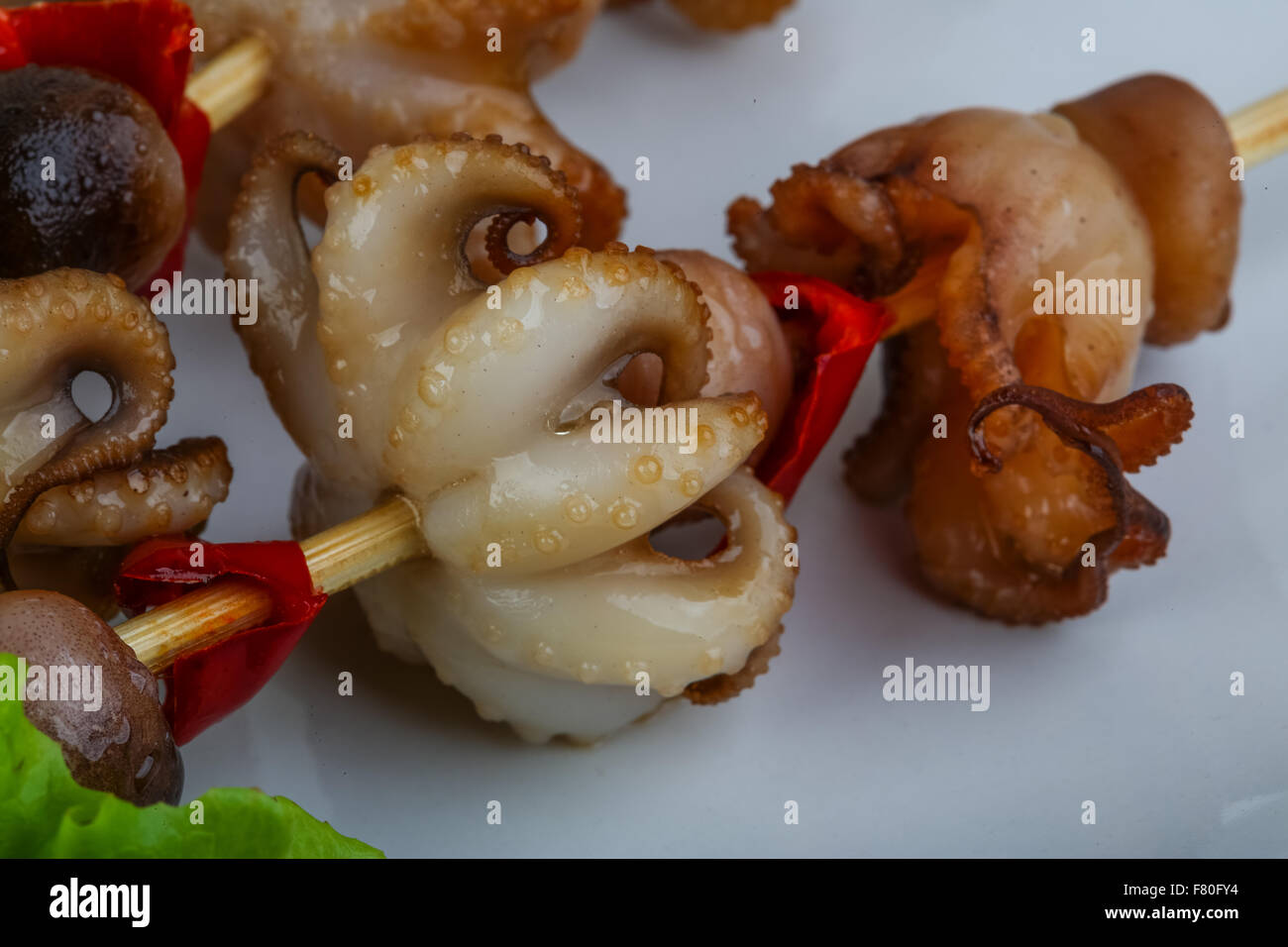 Grilled octopus skewers with red pepper and onion Stock Photo Alamy