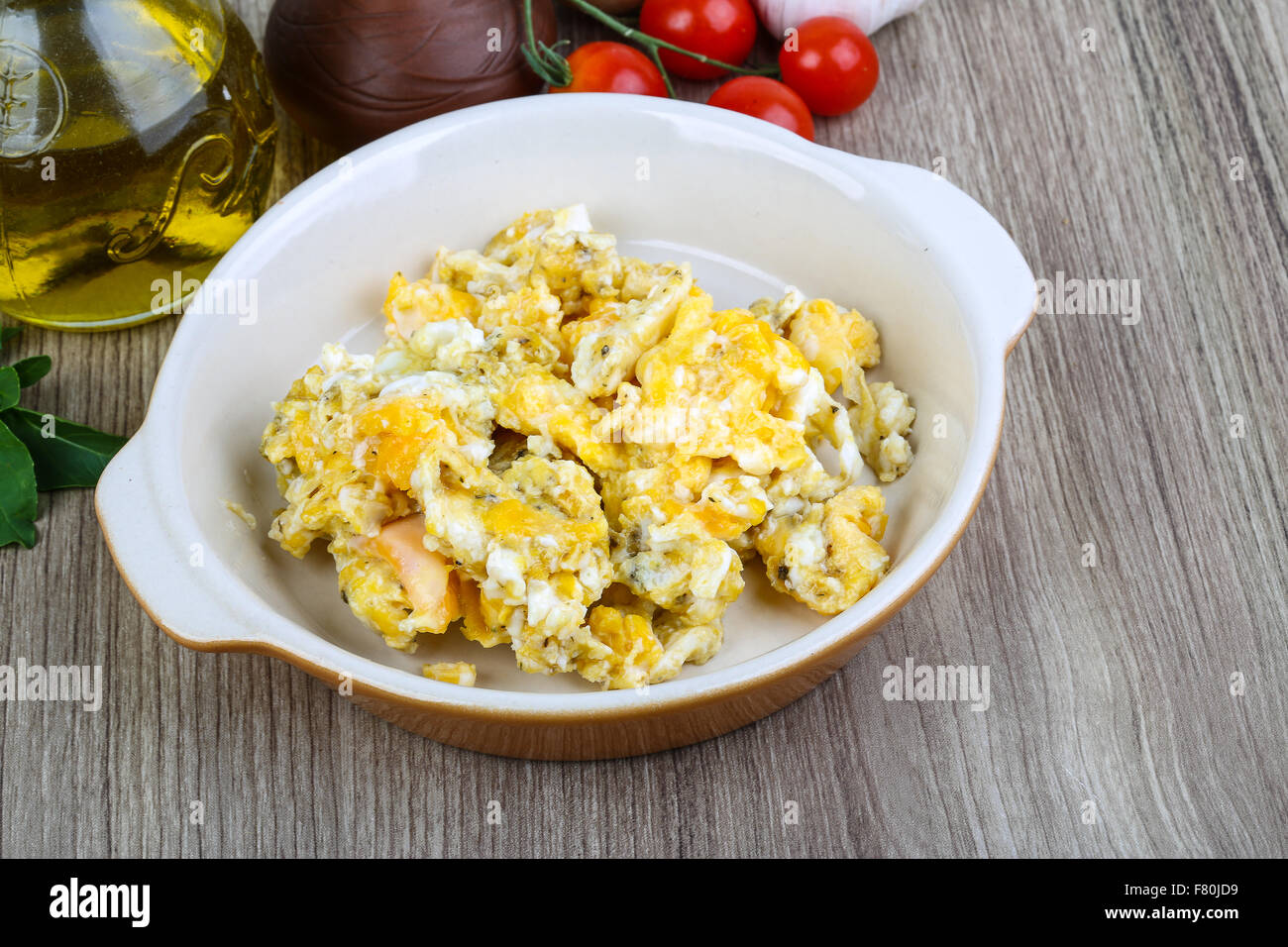 Scrambled eggs for breakfast on the wood background Stock Photo - Alamy