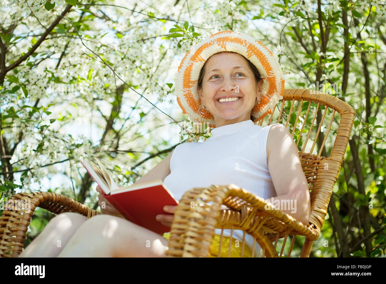 portrait of mature woman in spring blossoming garden Stock Photo - Alamy