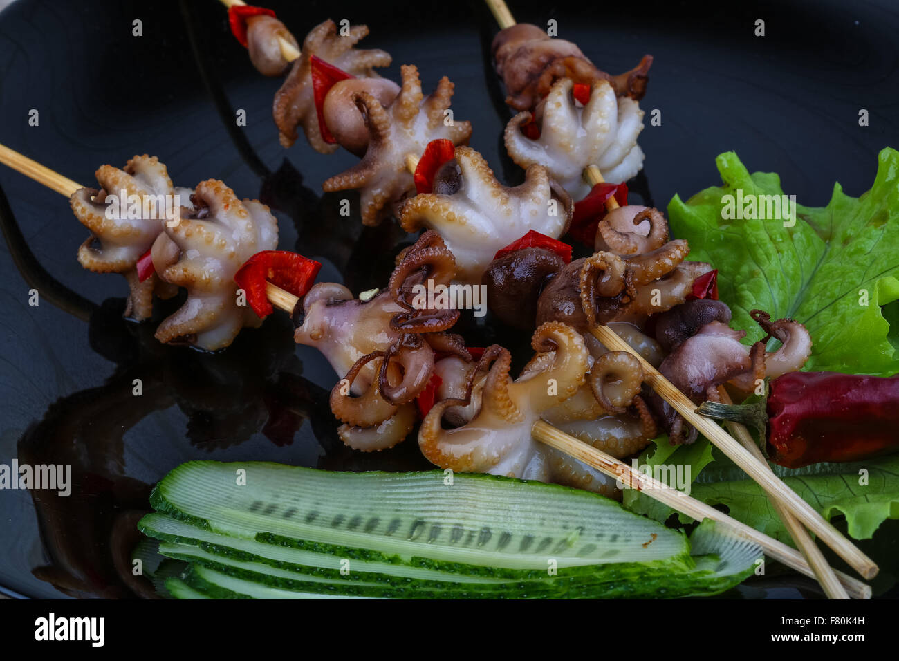Barbecue baby octopus with bell pepper and spices Stock Photo Alamy