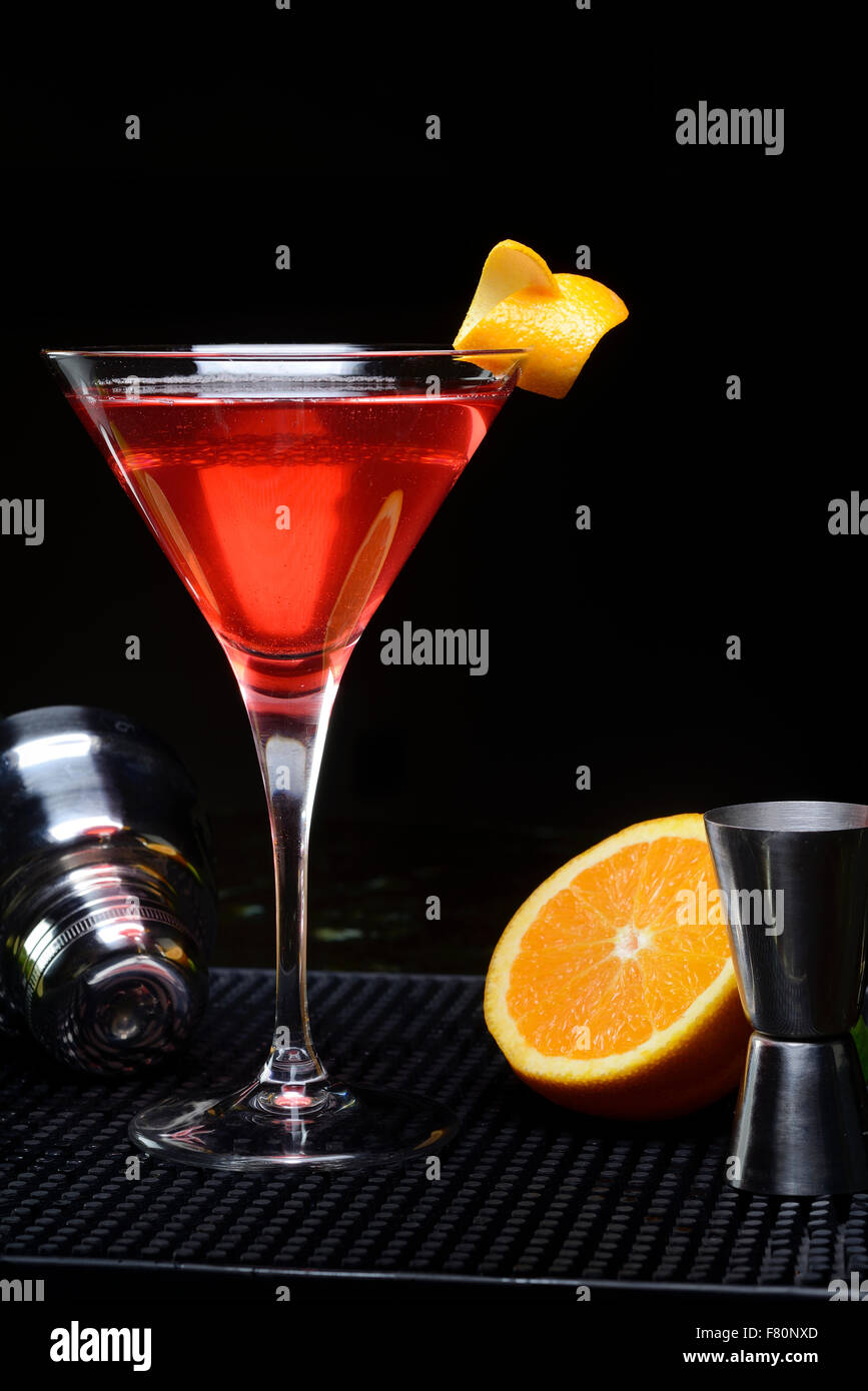 Red cocktail cosmo cosmopolitan martini glass barman hi-res stock ...