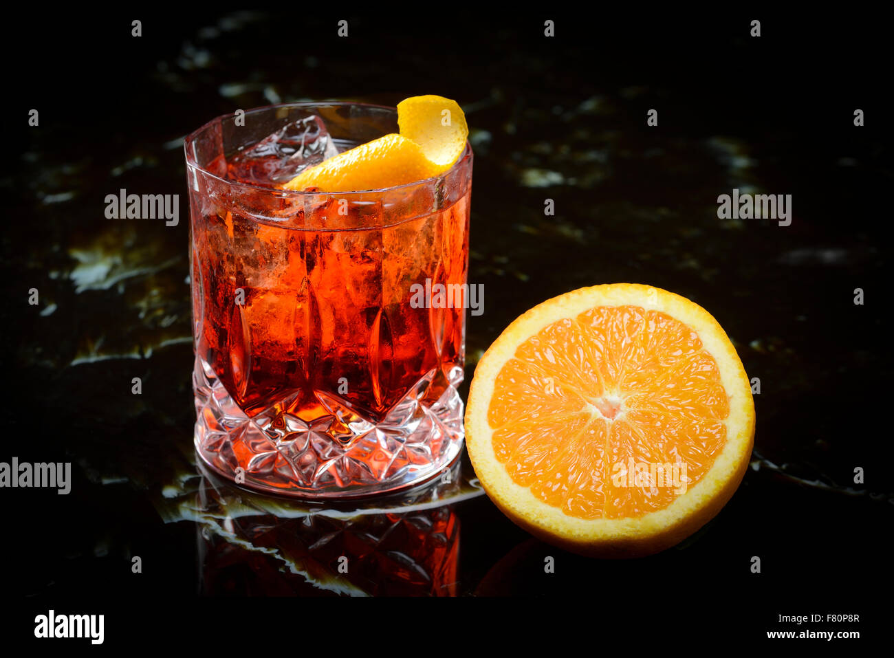 negroni on the rocks and orange Stock Photo