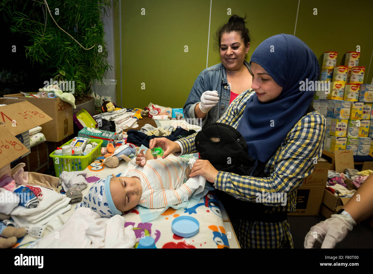 In the refugee arrival in Dortmund Keuning house the refugees of volunteers are supplied with food and clothing. Stock Photo