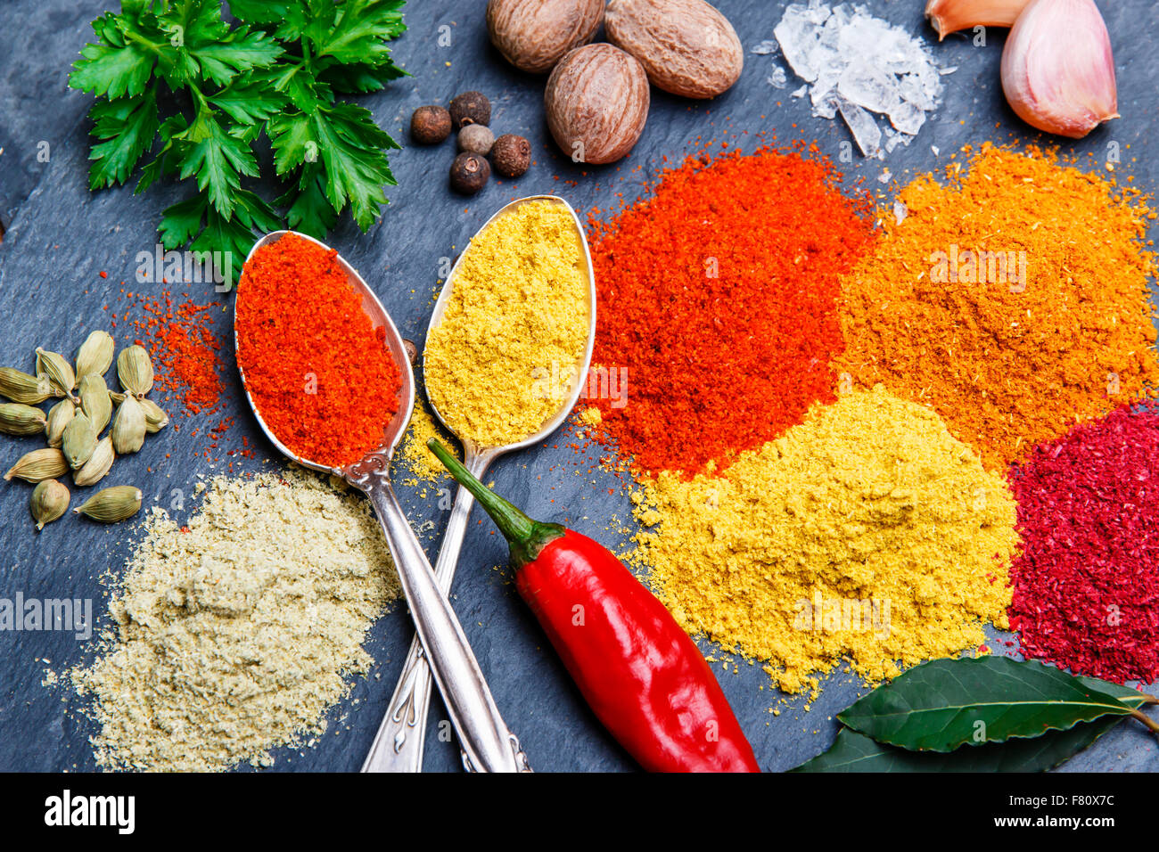 assortment of spices seasoning on a black stone Stock Photo