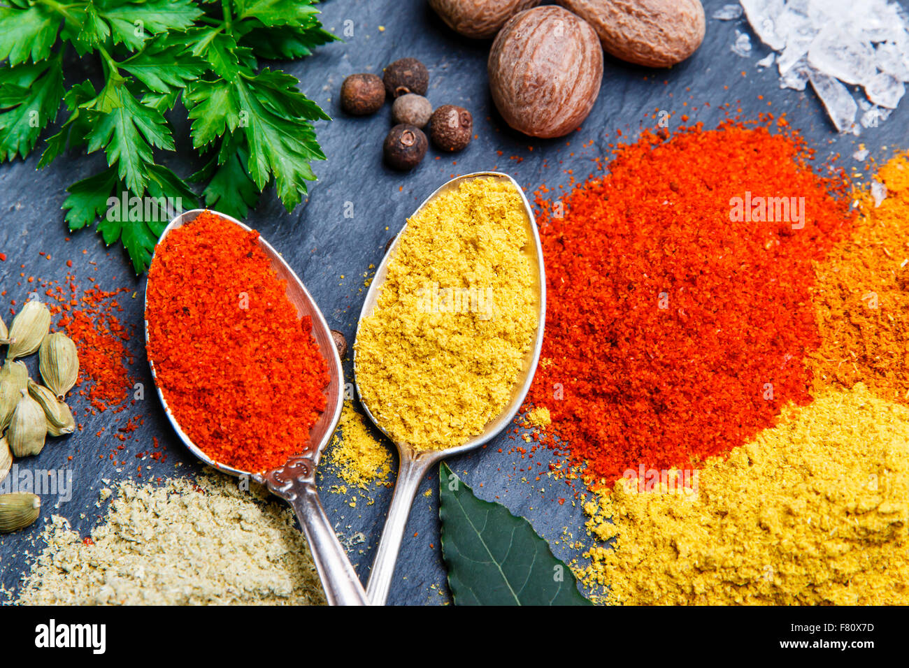 assortment of spices seasoning on a black stone Stock Photo