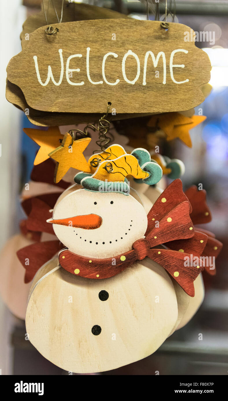 Snowman carved in wood to hang at home. Stock Photo
