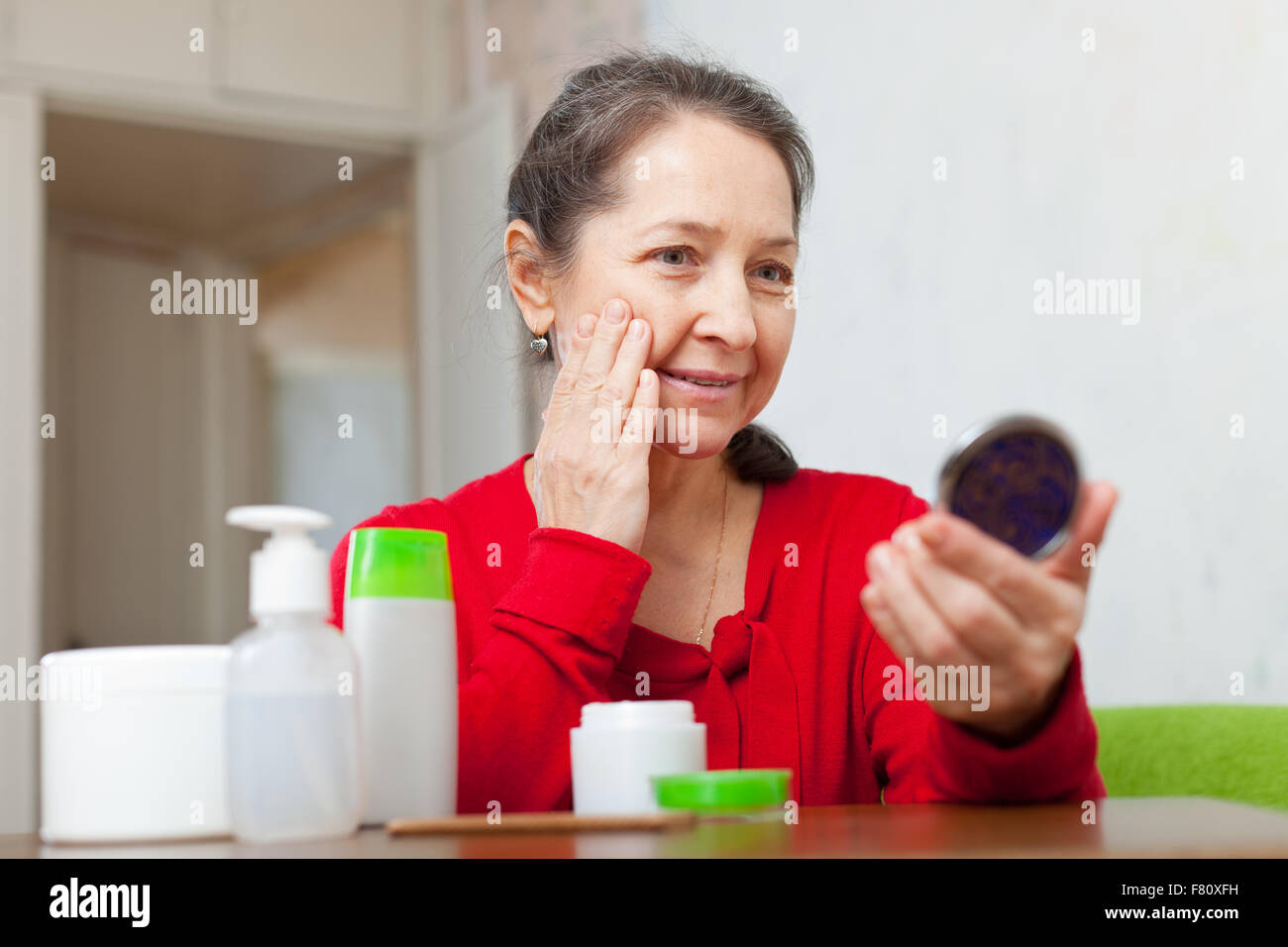 Mature woman mirror sad hi-res stock photography and images - Alamy