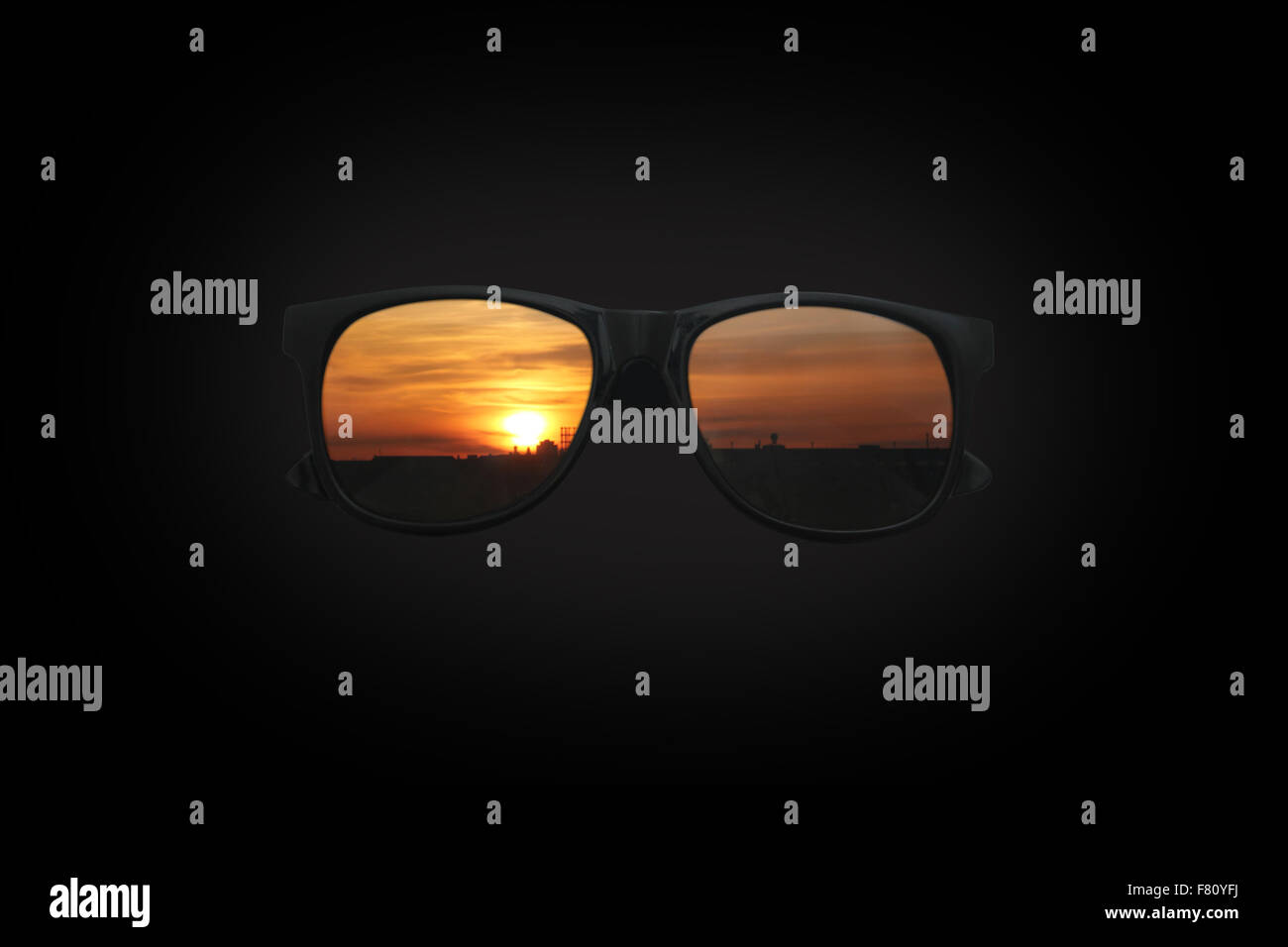 Sunglasses at Sunset on black Stock Photo