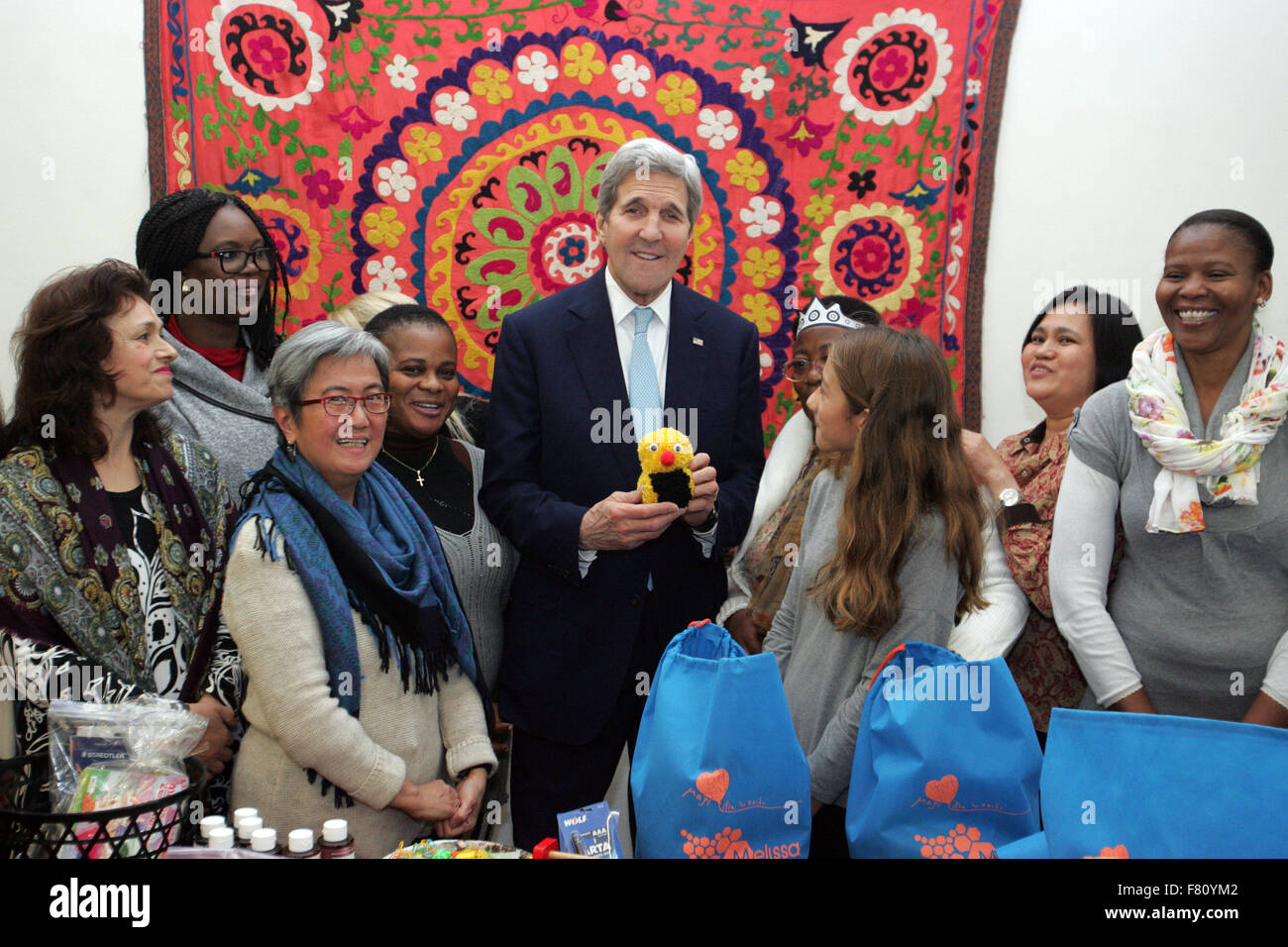 Athens, Greece. 4th Dec, 2015. U.S. Secretary of State John Kerry through  the process of filling welcome kits for refugee children, at the Melissa  Network, which promotes empowerment of migrant women. Kerry