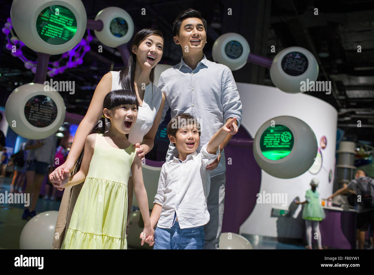 Young family in science and technology museum Stock Photo