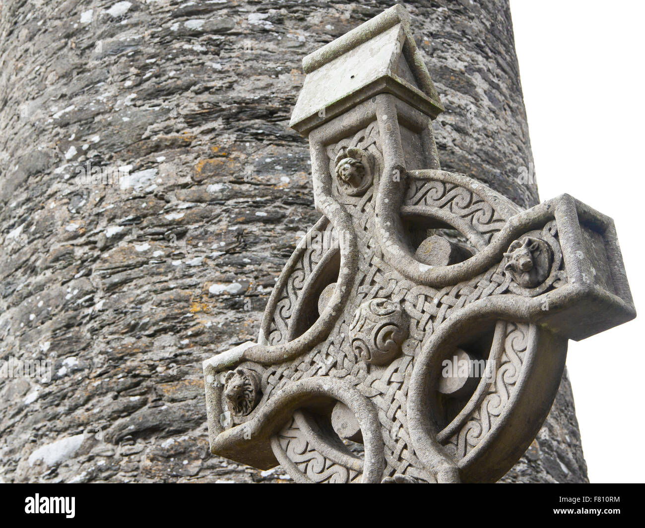 A old stone celtic cross in an irish graveyard, this cross is a traditional religious symbol in Ireland Stock Photo