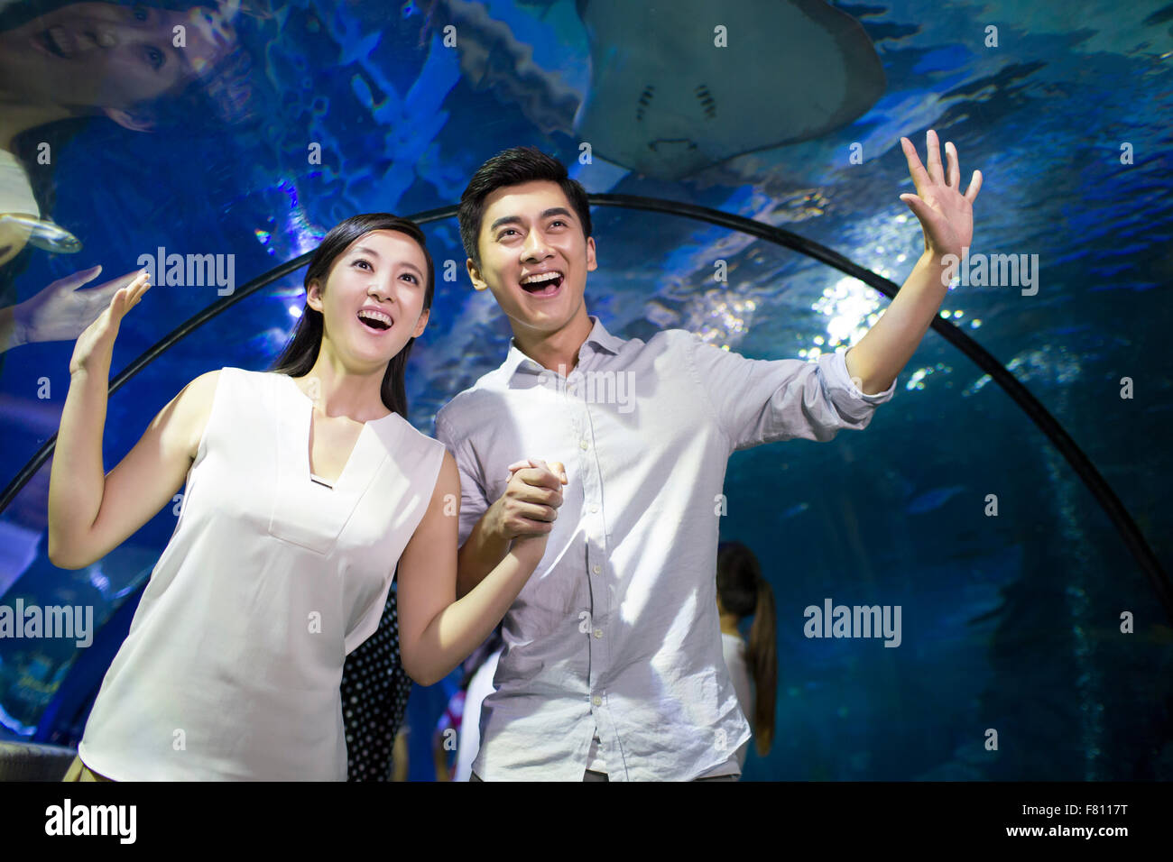 Young couple in aquarium Stock Photo