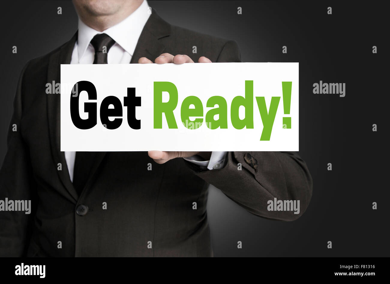 Get ready sign is held by businessman concept. Stock Photo