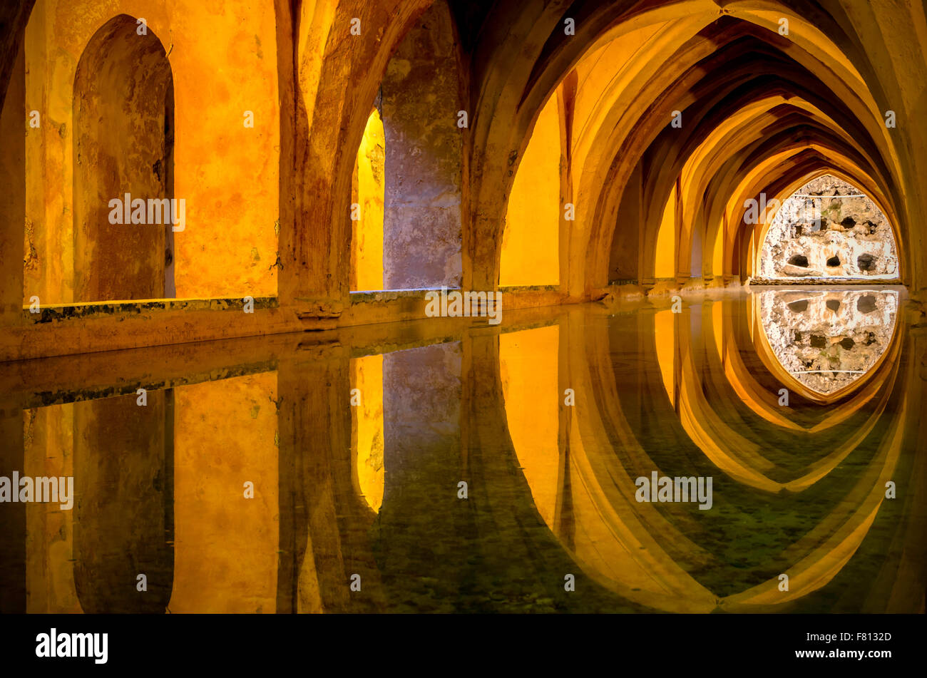 The 'Baths of Lady María de Padilla' are rainwater tanks beneath the Patio del Crucero. Stock Photo