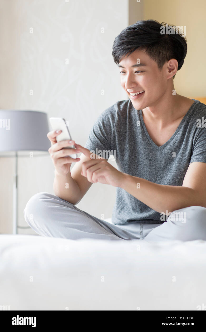 Young man sitting neat desk hi-res stock photography and images - Alamy