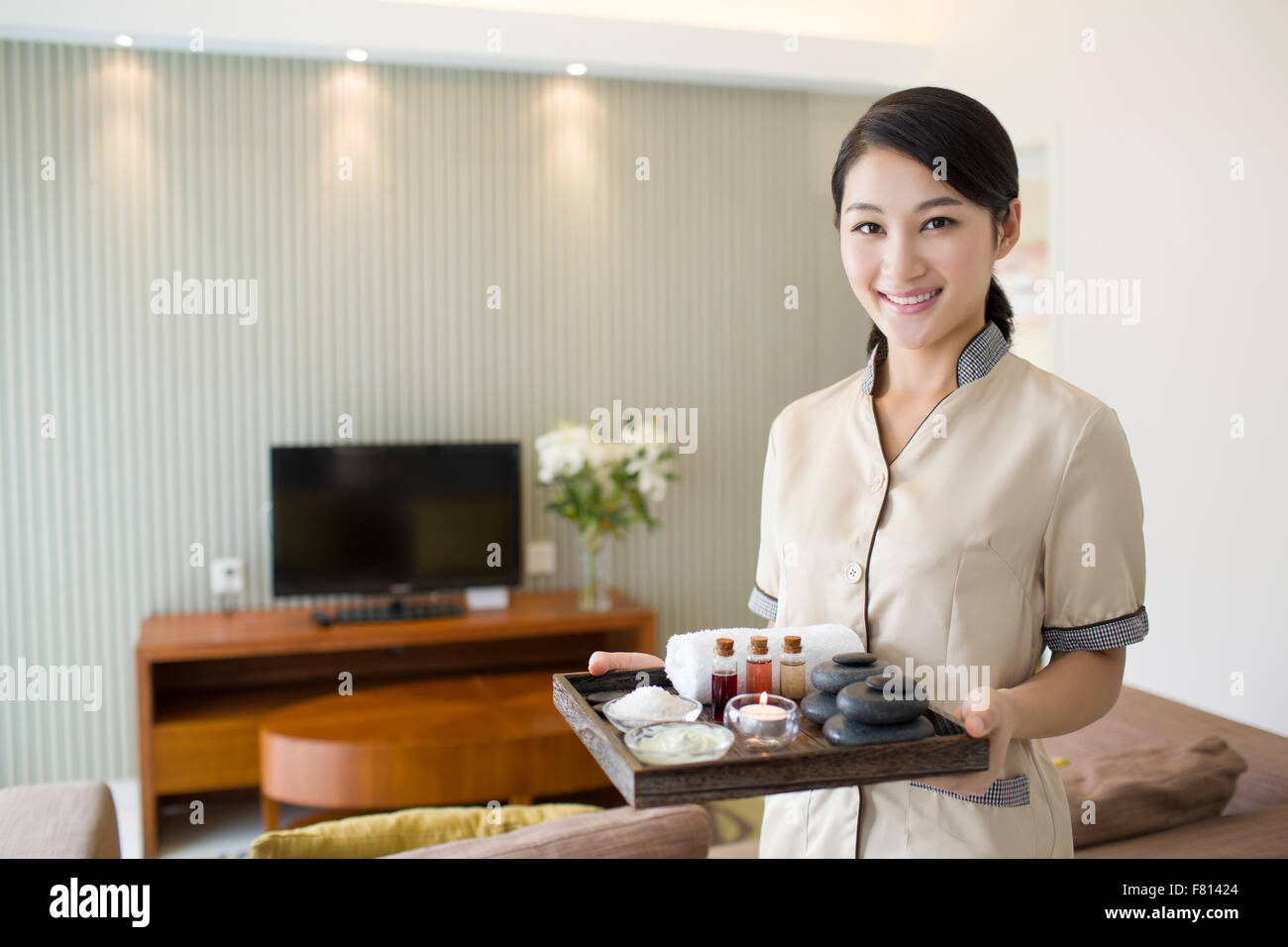 Massage therapist holding massage supplies Stock Photo Alamy