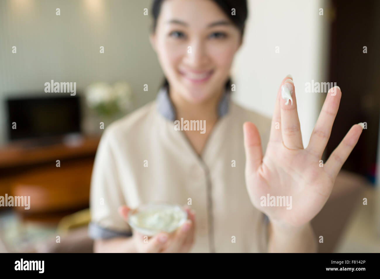 Massage therapist showing massage supplies Stock Photo Alamy