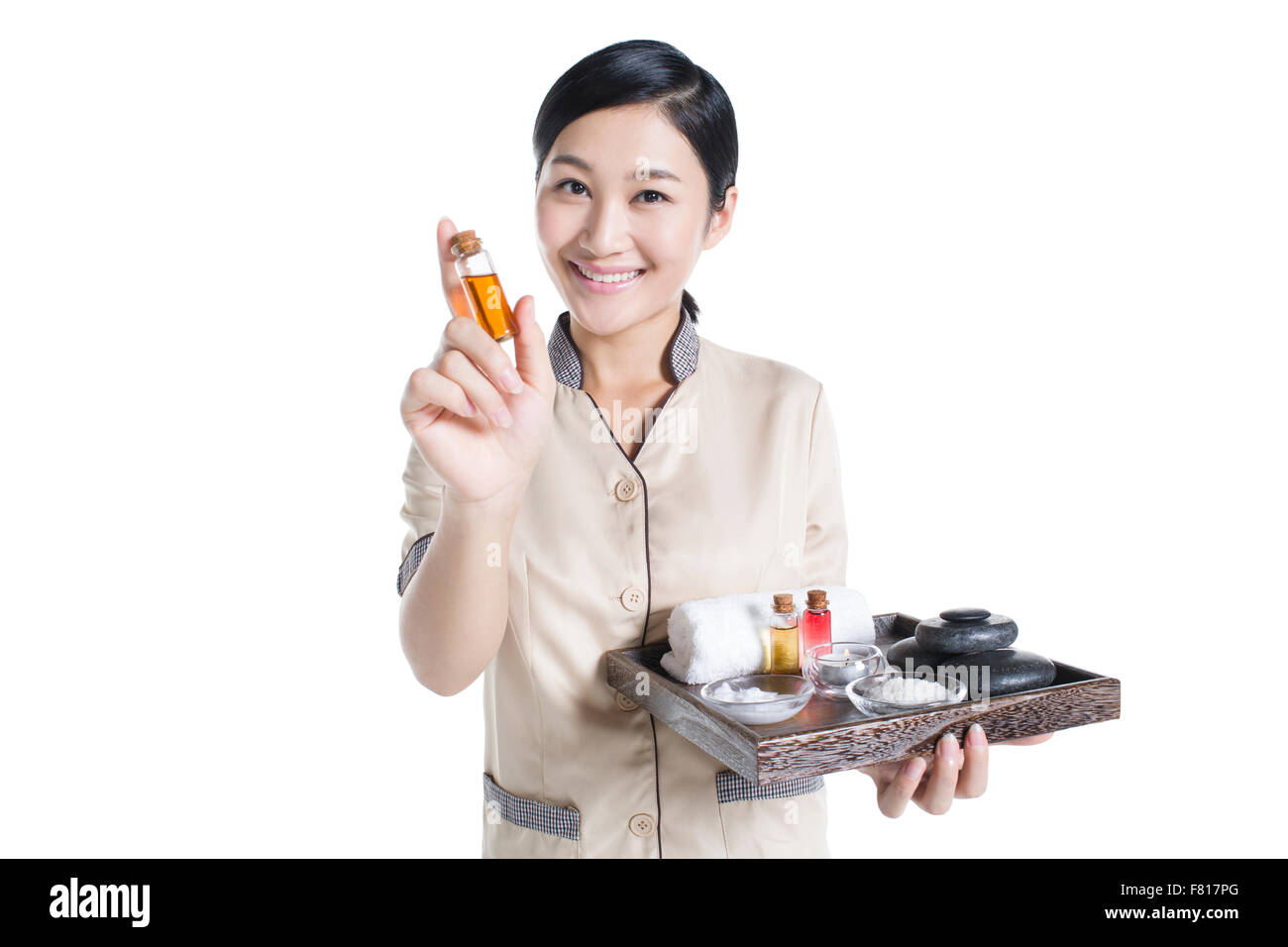 Massage therapist showing massage supplies Stock Photo Alamy