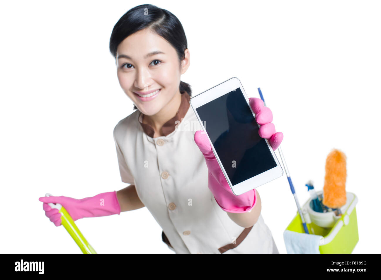 Cleaner showing a smart phone Stock Photo - Alamy