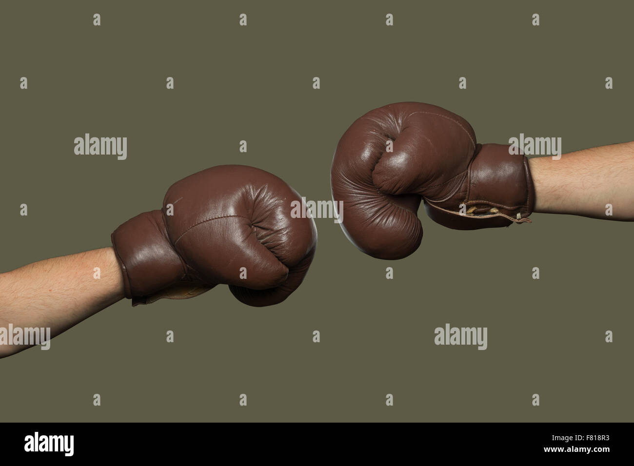 Two brown old boxing gloves hit together Stock Photo Alamy