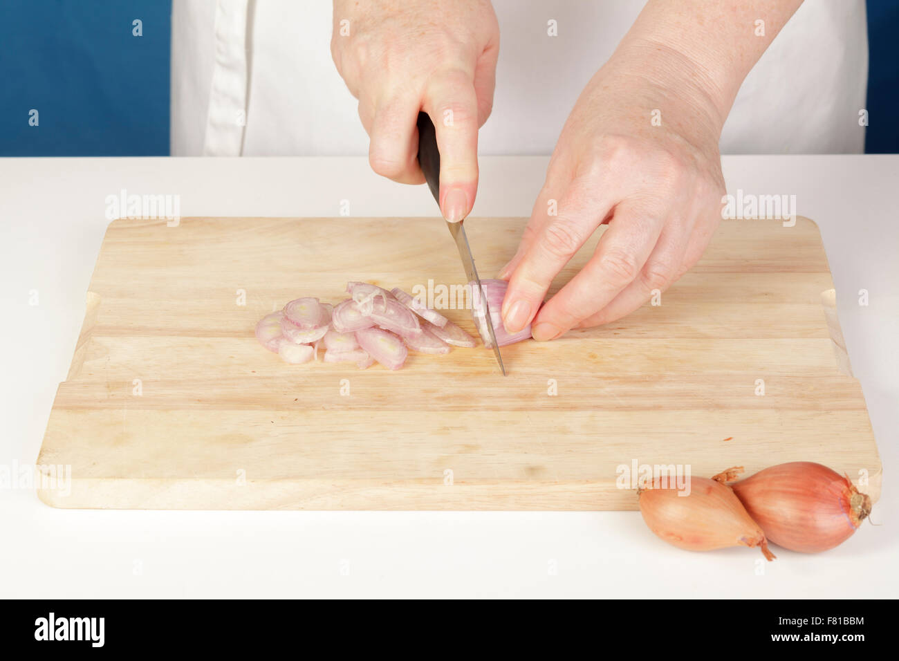 Chef cutting shallots Stock Photo