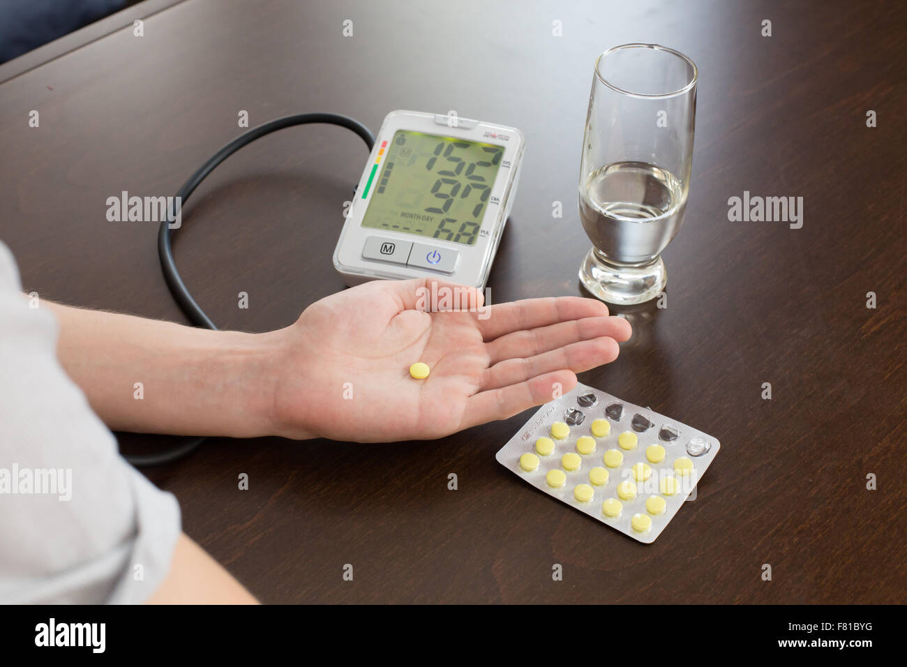 Man measures blood pressure home hi-res stock photography and images ...