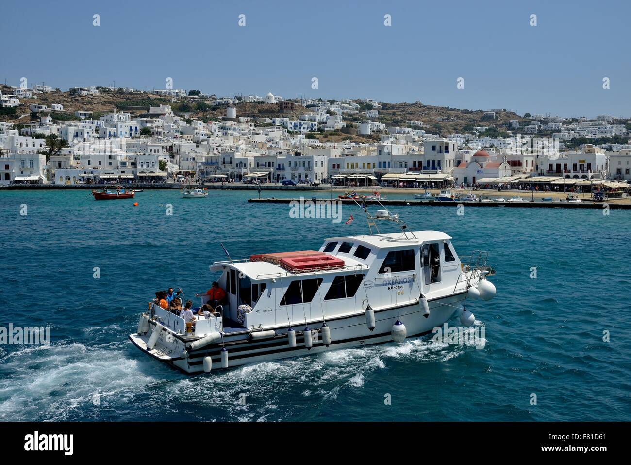 Excursion boat in the harbor of Mykonos Town or Chora, Mykonos, Cyclades, Greece Stock Photo