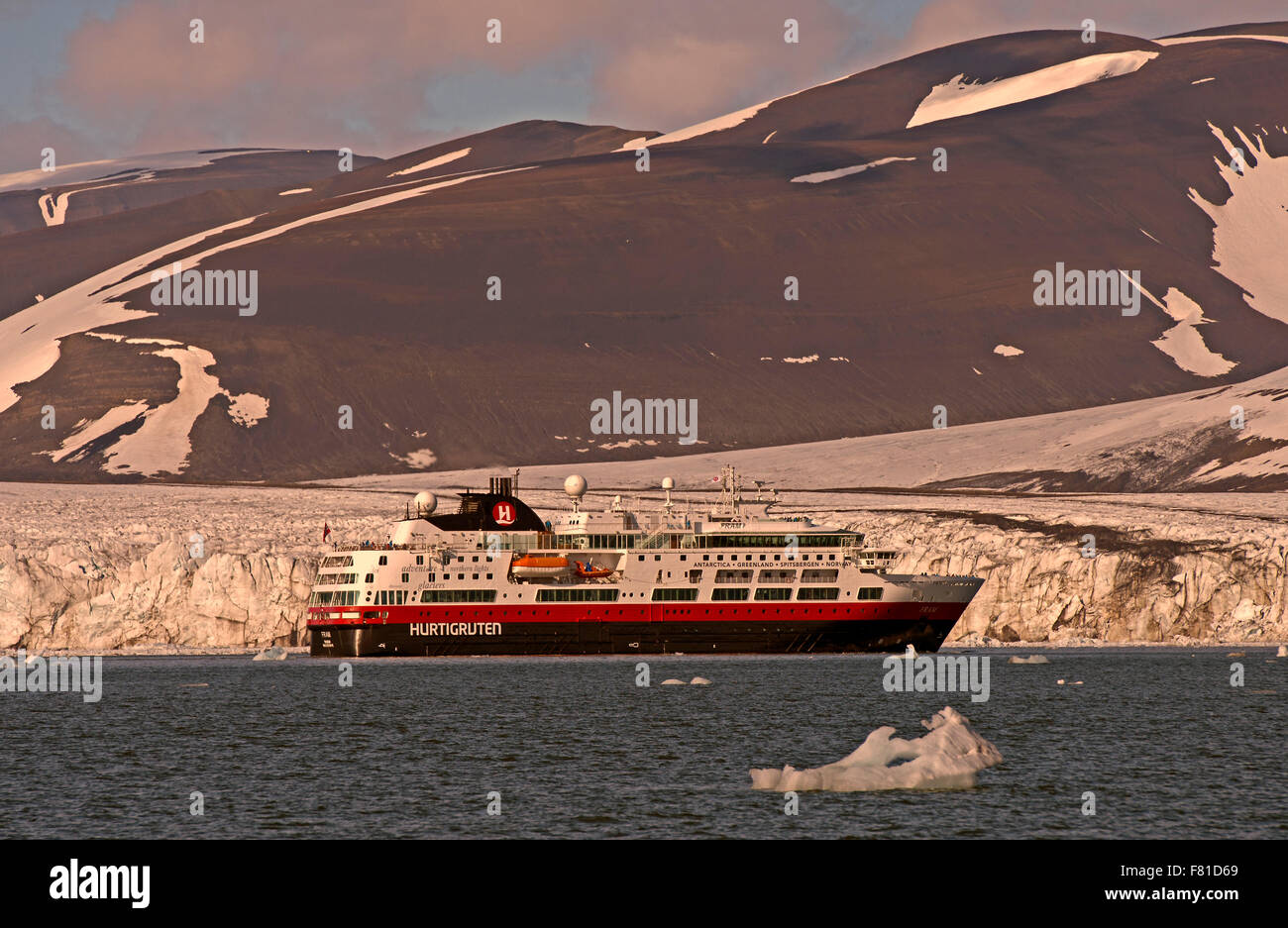 Hurtigruten ship in Hornsund, Storbreen glacier behind, Spitsbergen, Arctic, Norway Stock Photo